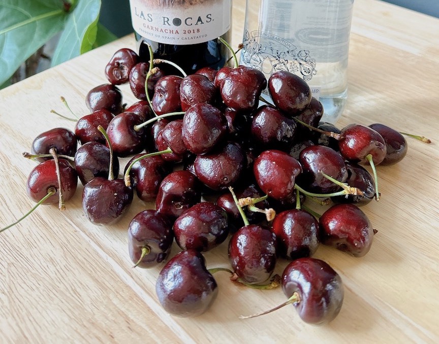 Portuguese cherry liqueur recipe, showcasing ingredients and preparation.