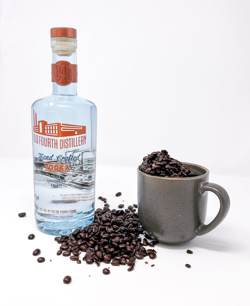 Homemade Coffee Infused Vodka in a glass bottle, featuring rich, dark coffee beans steeped in vodka for a bold and aromatic spirit, perfect for cocktails or sipping