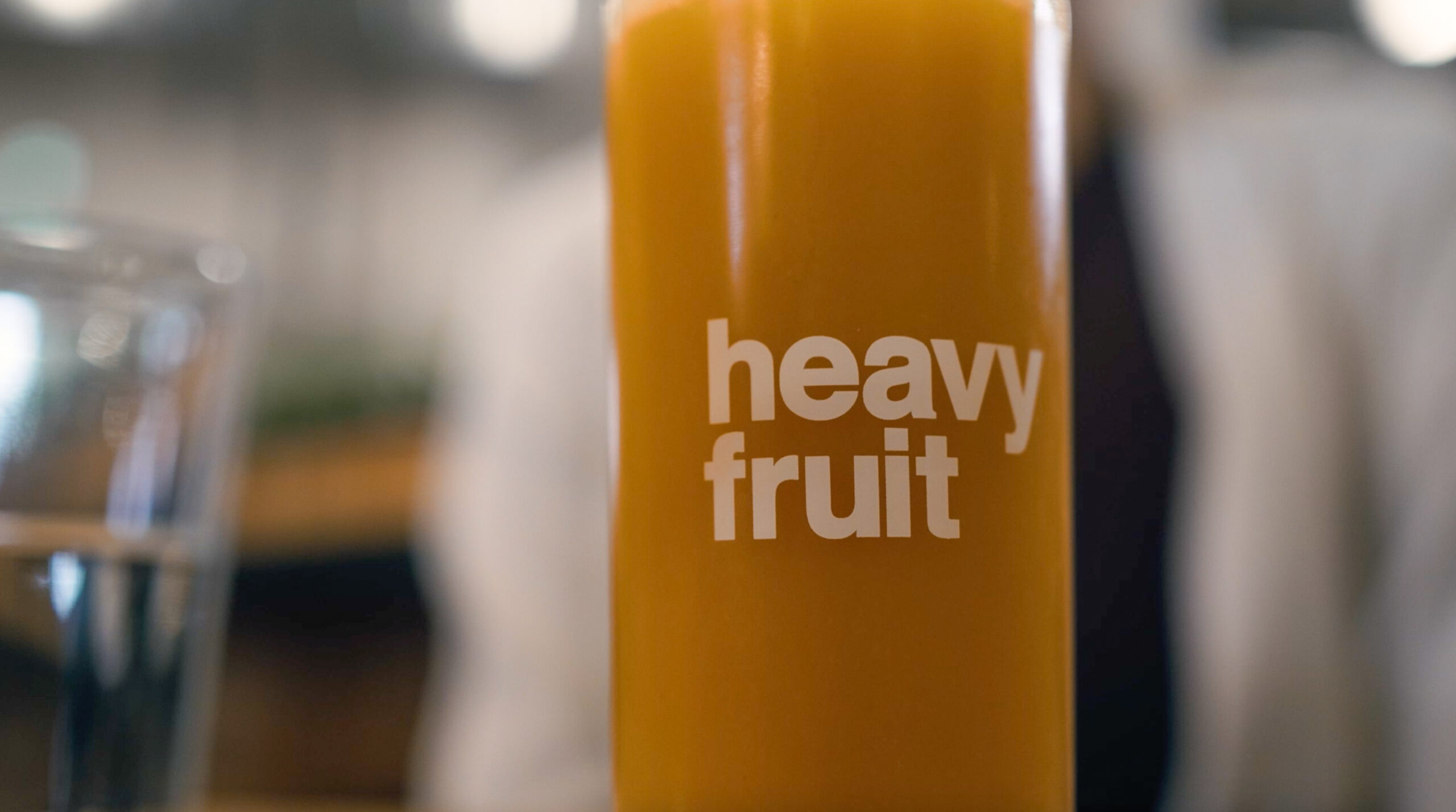 Close-up of a hazy beer can labeled “heavy fruit” at Superflux Beer Company in Vancouver.