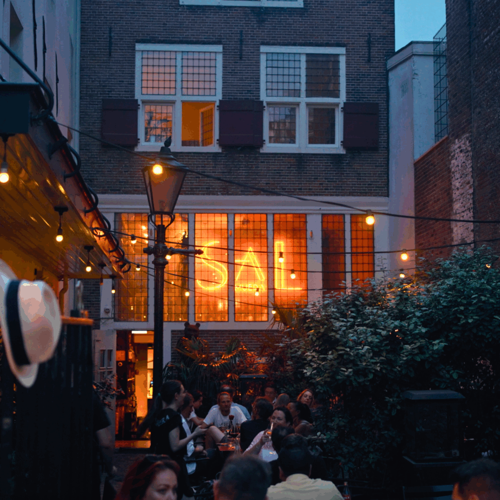 Entrance to Salmuera in Amsterdam, an Argentine-inspired restaurant known for fire-grilled meats and rustic charm.