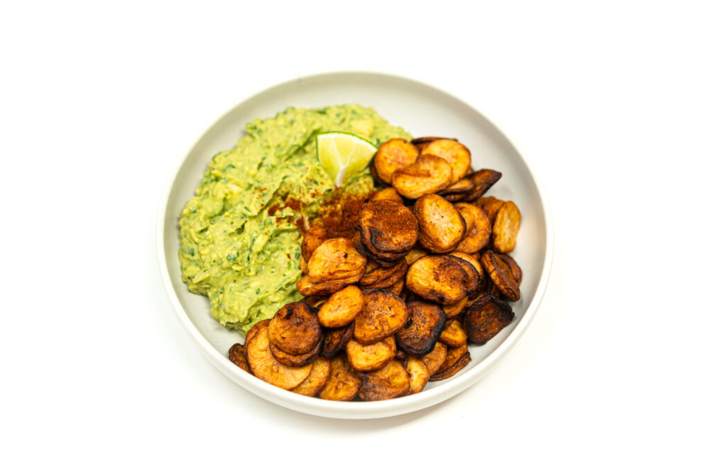 Crispy deep-fried green banana chips served with a creamy Thai-inspired guacamole featuring fish-sauce-macerated shallots and agave.