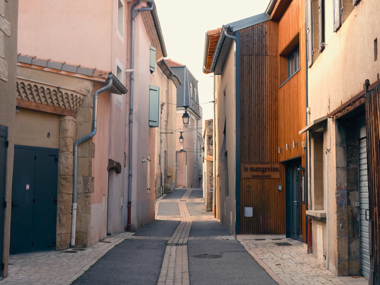 A quiet, narrow cobblestone street in the winemaking town of Tain L'Hermitage.