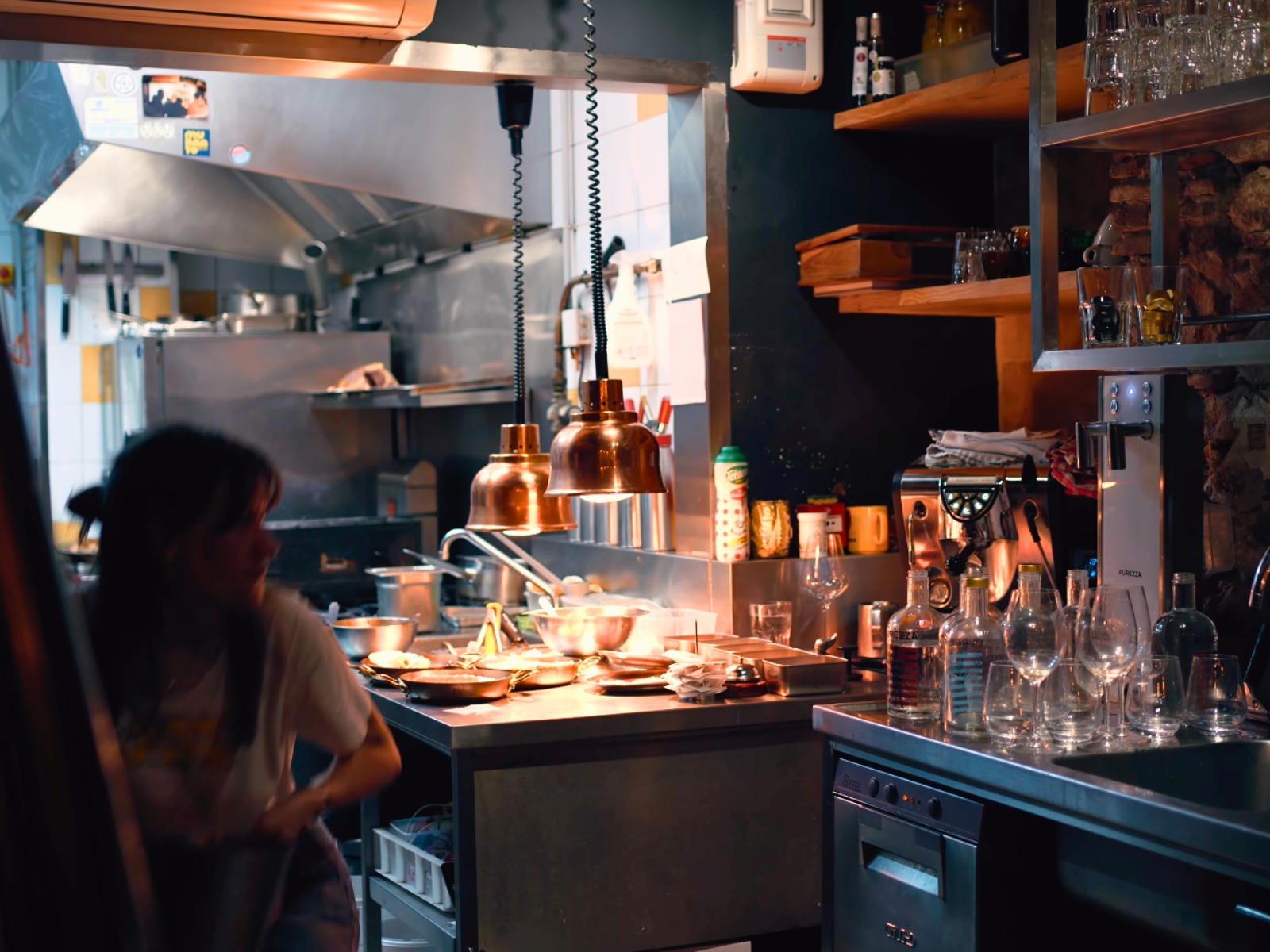 Chefs working in the vibrant open kitchen at Armada neo-bistro.