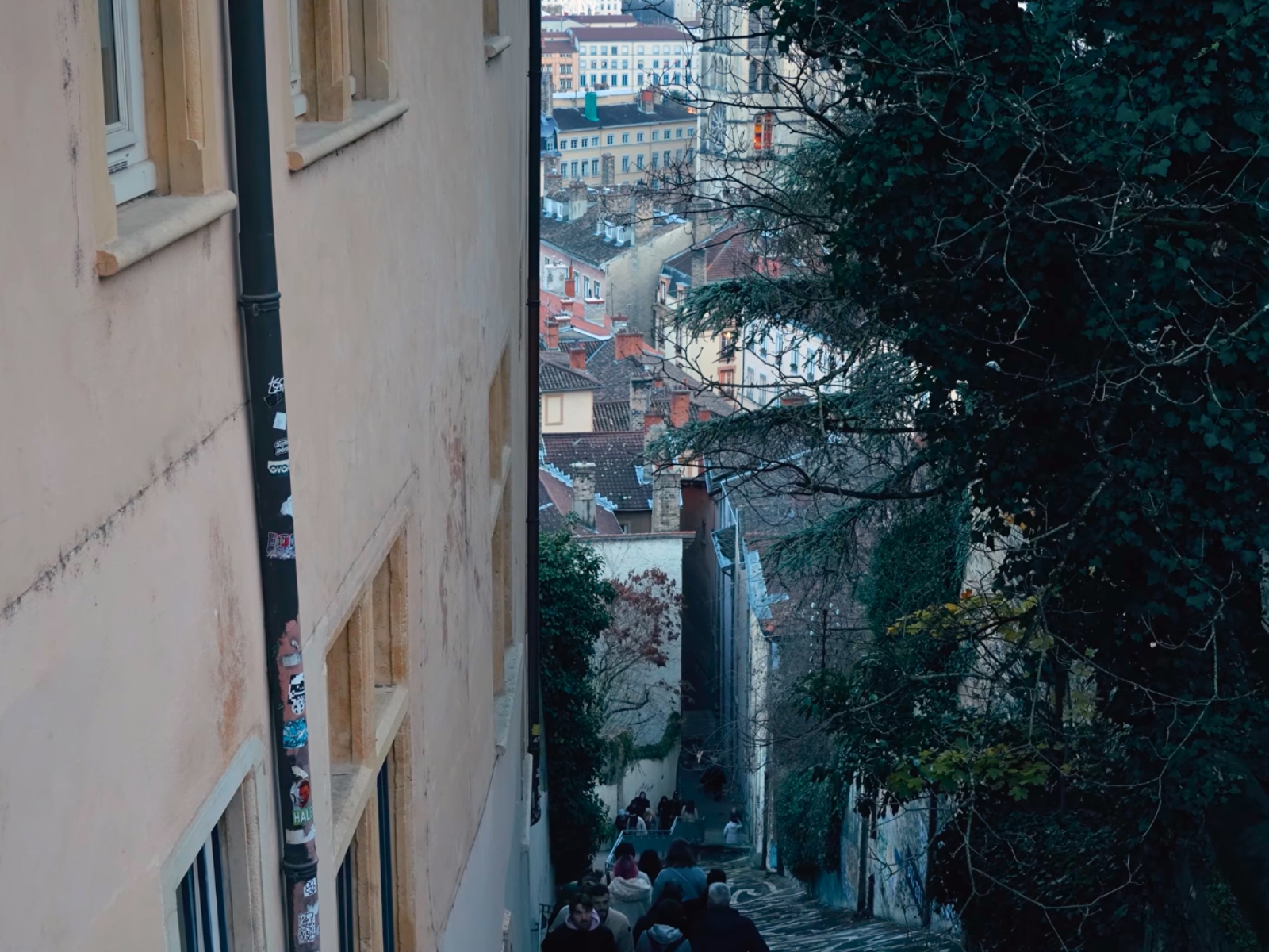 A view looking down a steep, narrow historic street in Vieux Lyon.