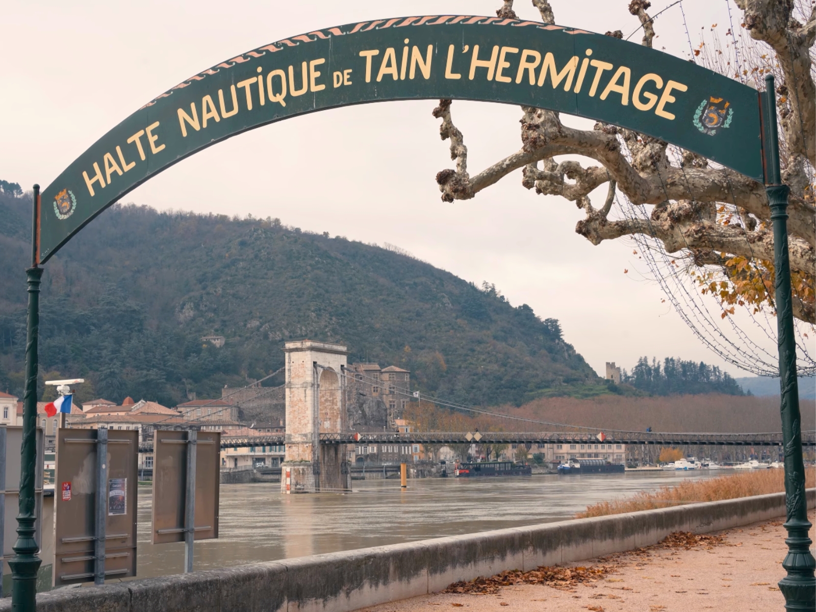 The stone archway reading Halte Nautique de Tain L'Hermitage along the Rhône River.
