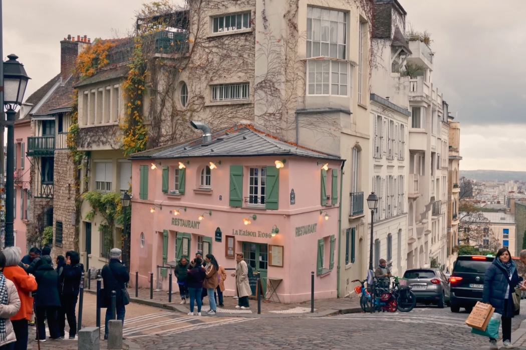 Street view of historic buildings and classic Parisian architecture in the Montmartre neighborhood.
