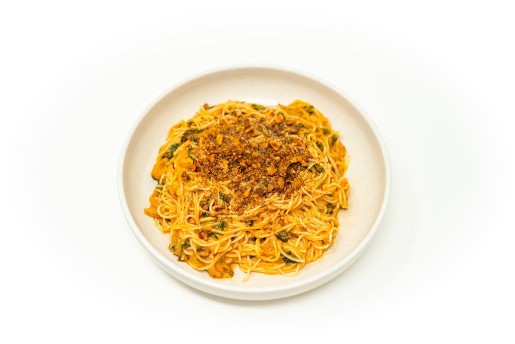 Korean wheat noodles tossed in a rich calabaza tomato cream sauce, topped with charred bok choy, crispy shallots, and fried garlic.